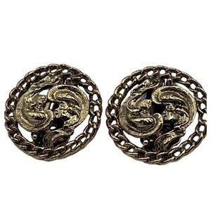 Vintage Kramer gold colored cut out design clip earrings.